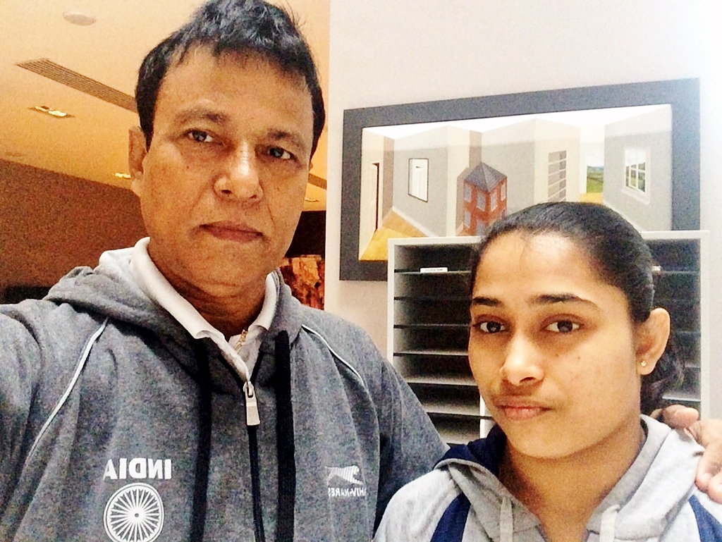 Glasgow: Dipa Karmakar with her coach in Glasgow Oct 29, 2015. The 22-year-old made history after becoming the first Indian to qualify for the finals of World Gymnastics Championships. (Photo: IANS)