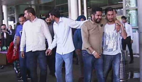 Manmeet's brother (third from left) arrives at Brisbane airport @ABC